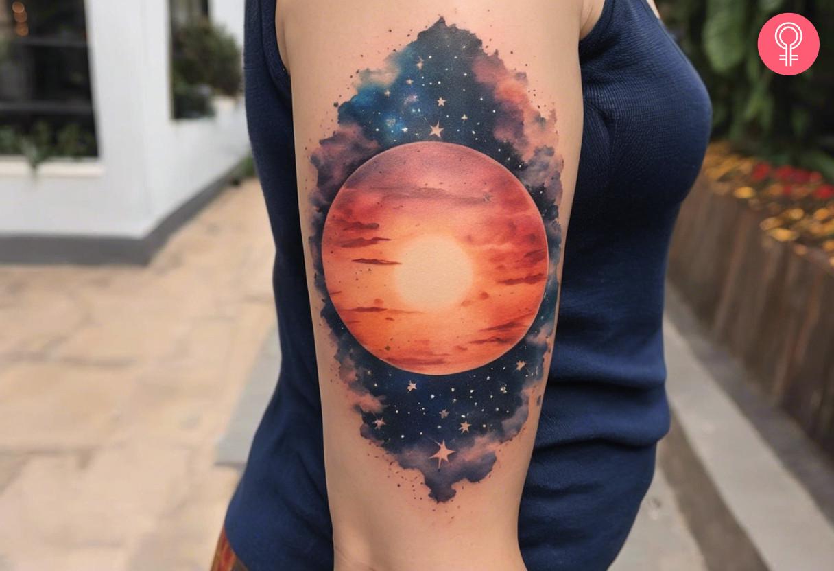 Celestial sun tattoo on upper arm