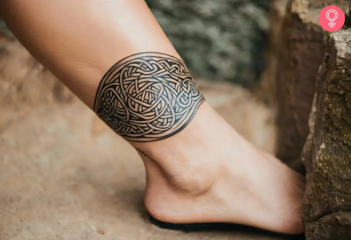 Woman with a Celtic leg band tattoo around the ankle