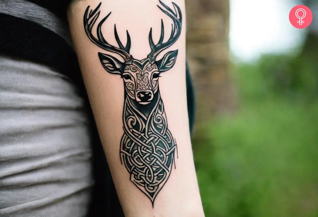 Woman with a Celtic stag tattoo on the forearm