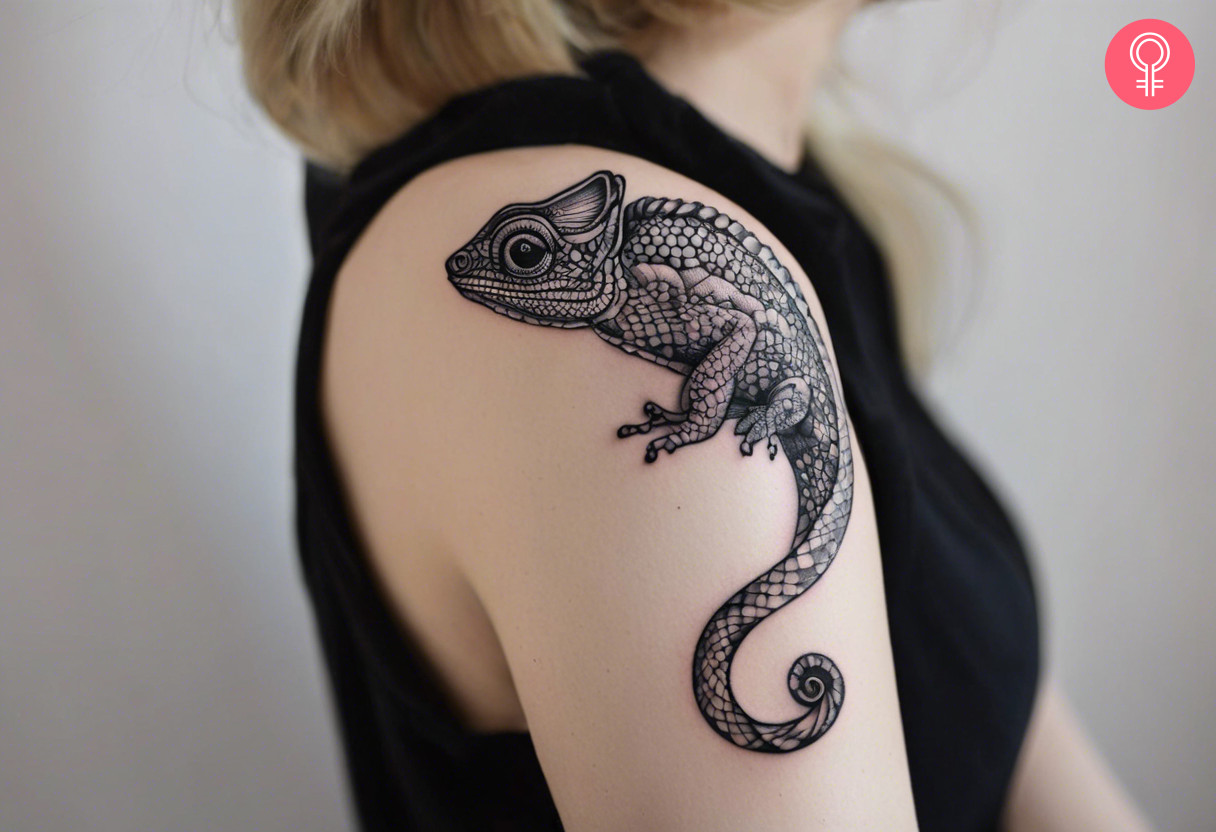 Chameleon tattoo in black and white on the shoulder