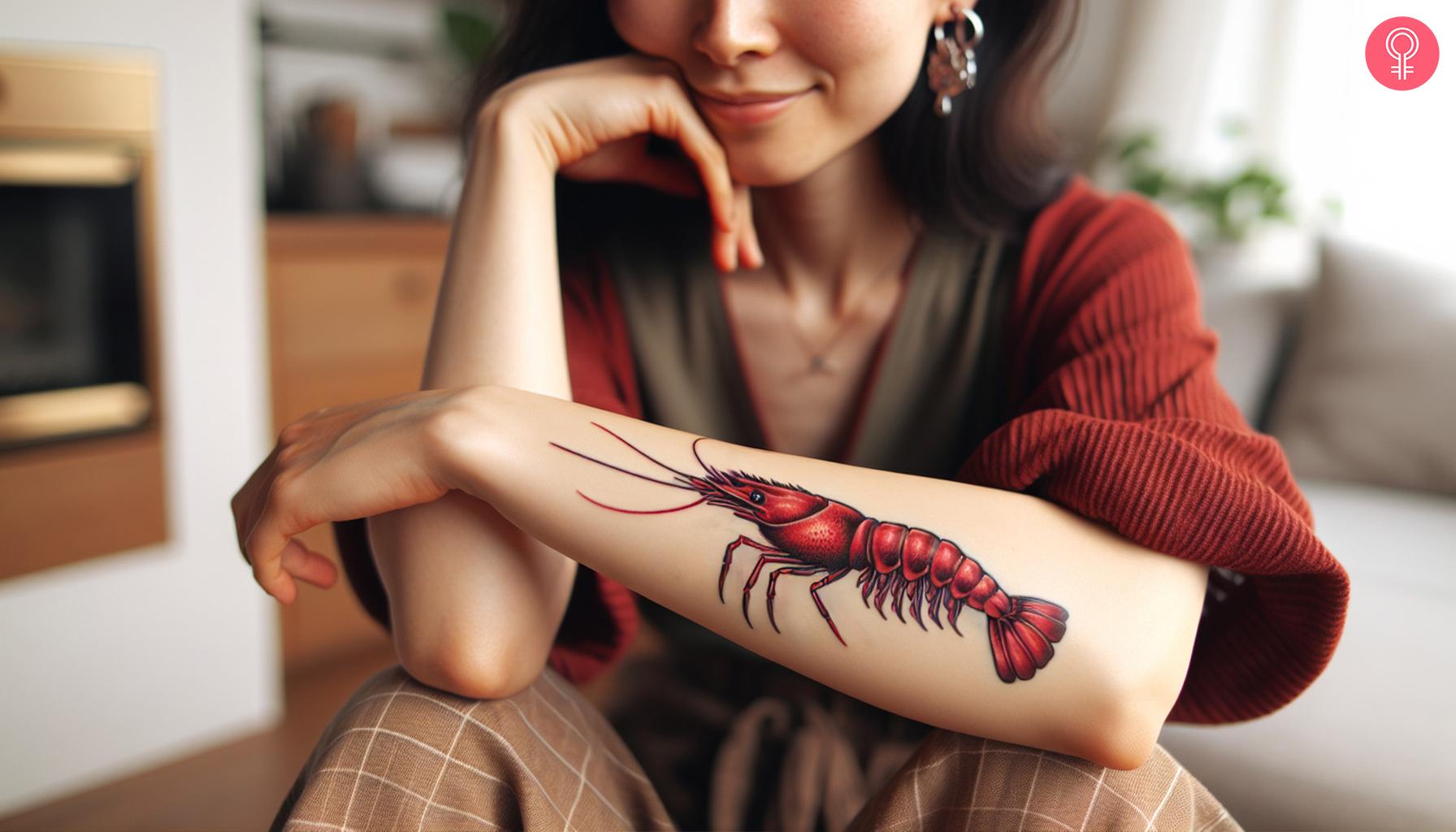 Cherry shrimp tattoo on a woman's forearm