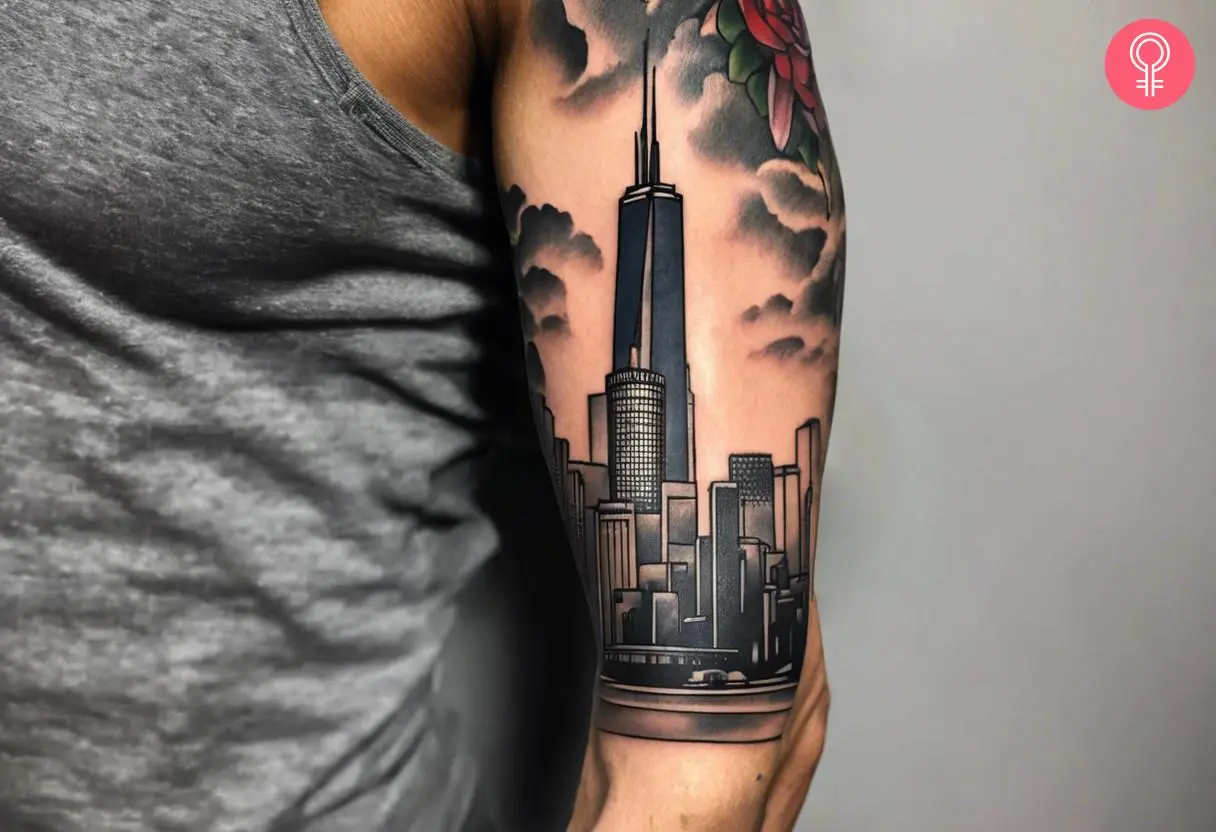 A Chicago skyline tattoo sleeve on the upper arm of a man