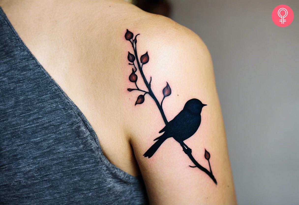 Silhouette of a tit tattoo on the shoulder