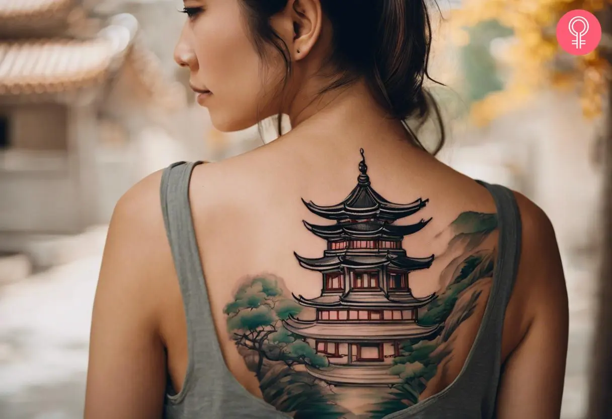 Chinese pagoda tattoo on the upper back of a woman