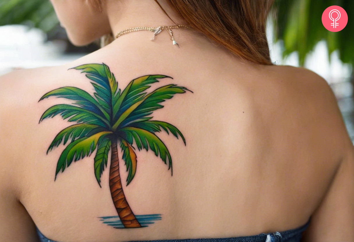 Coconut tree tattoo on the shoulder blade