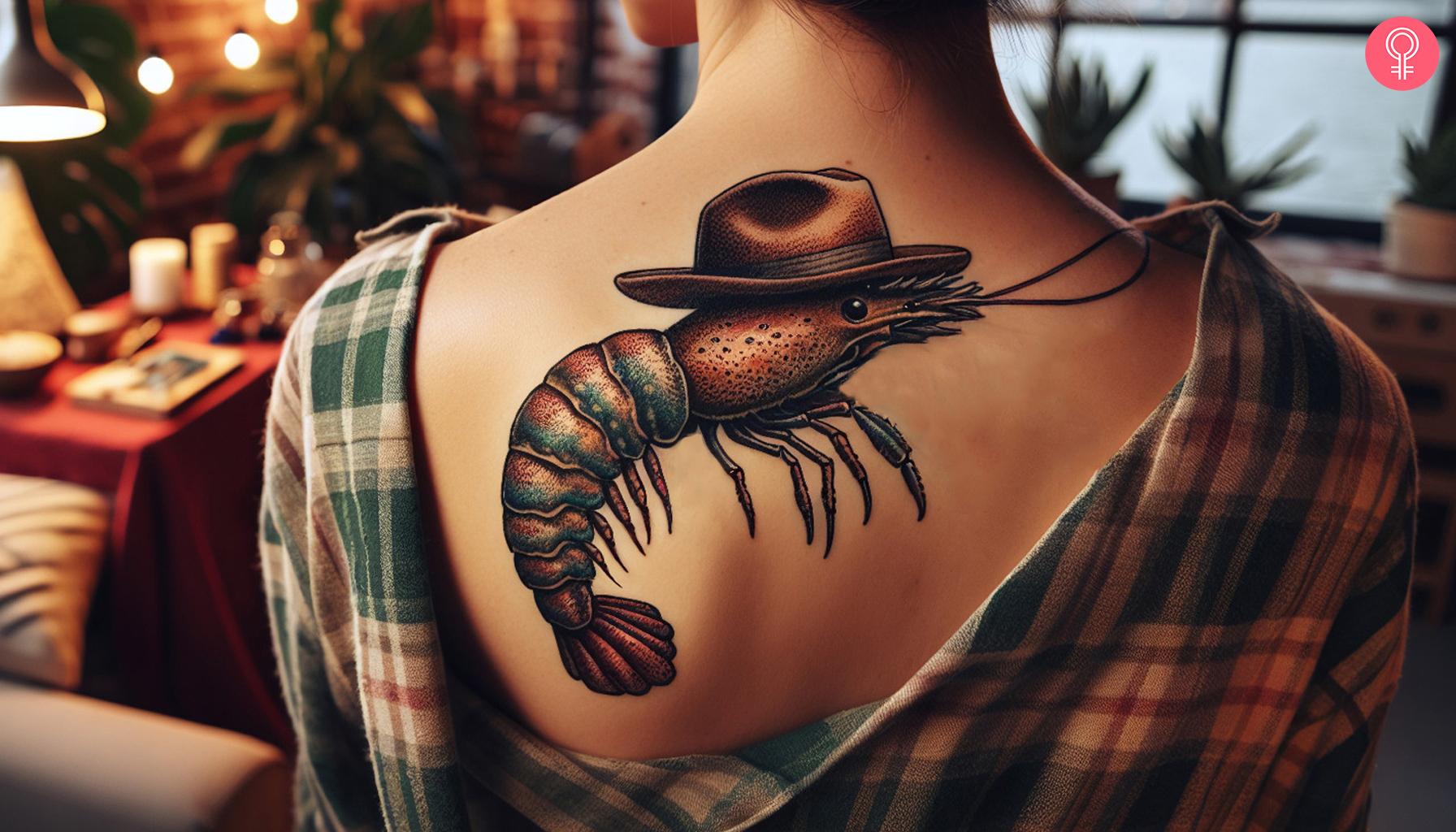 Cowboy shrimp tattoo on back of shoulder