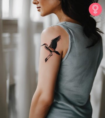 A woman with an avocado tattoo on the upper arm