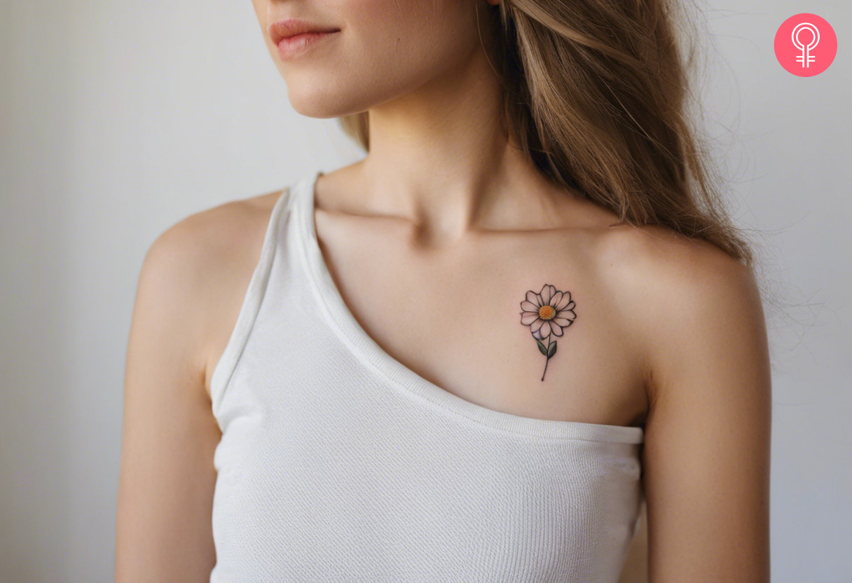 Delicate flower tattoo on the front shoulder