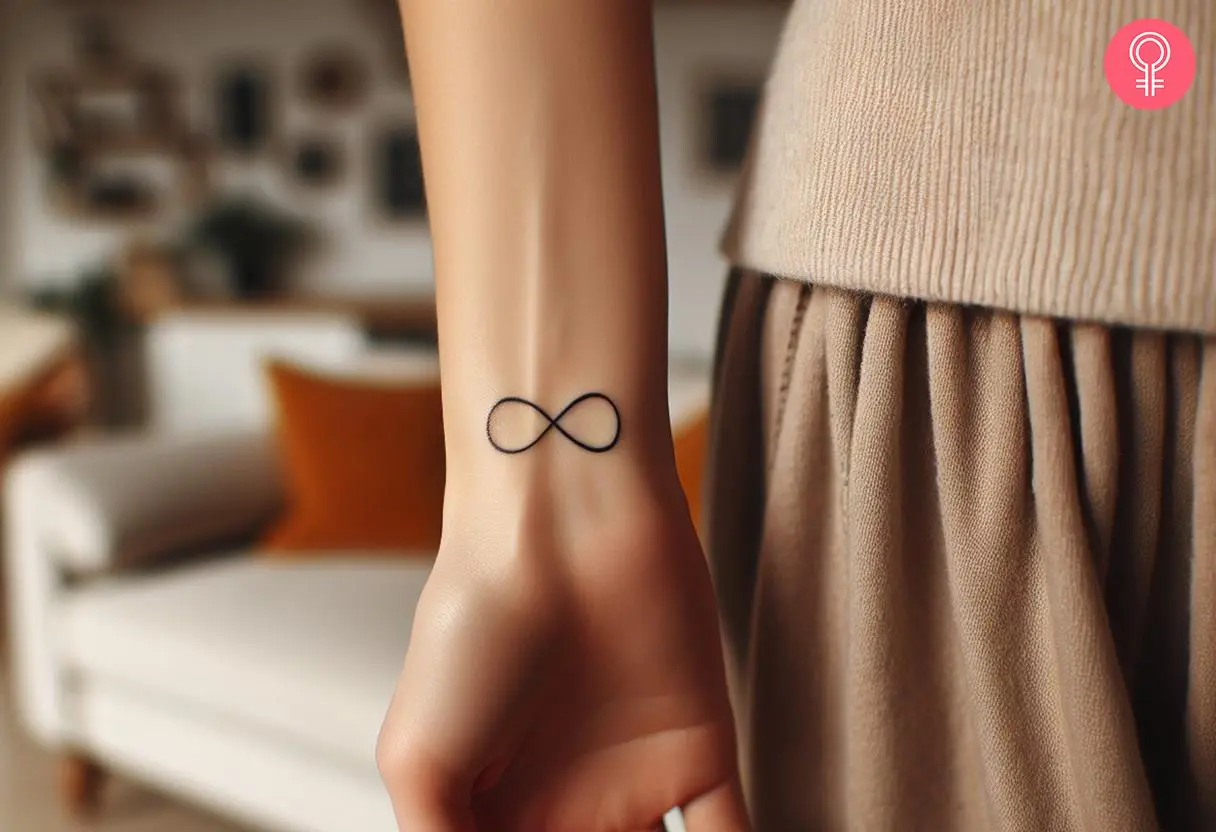 Delicate infinity sign tattoo on the wrist