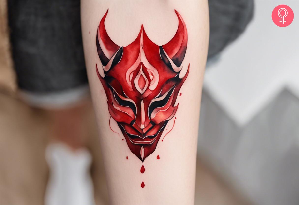 Demon mask tattoo on forearm