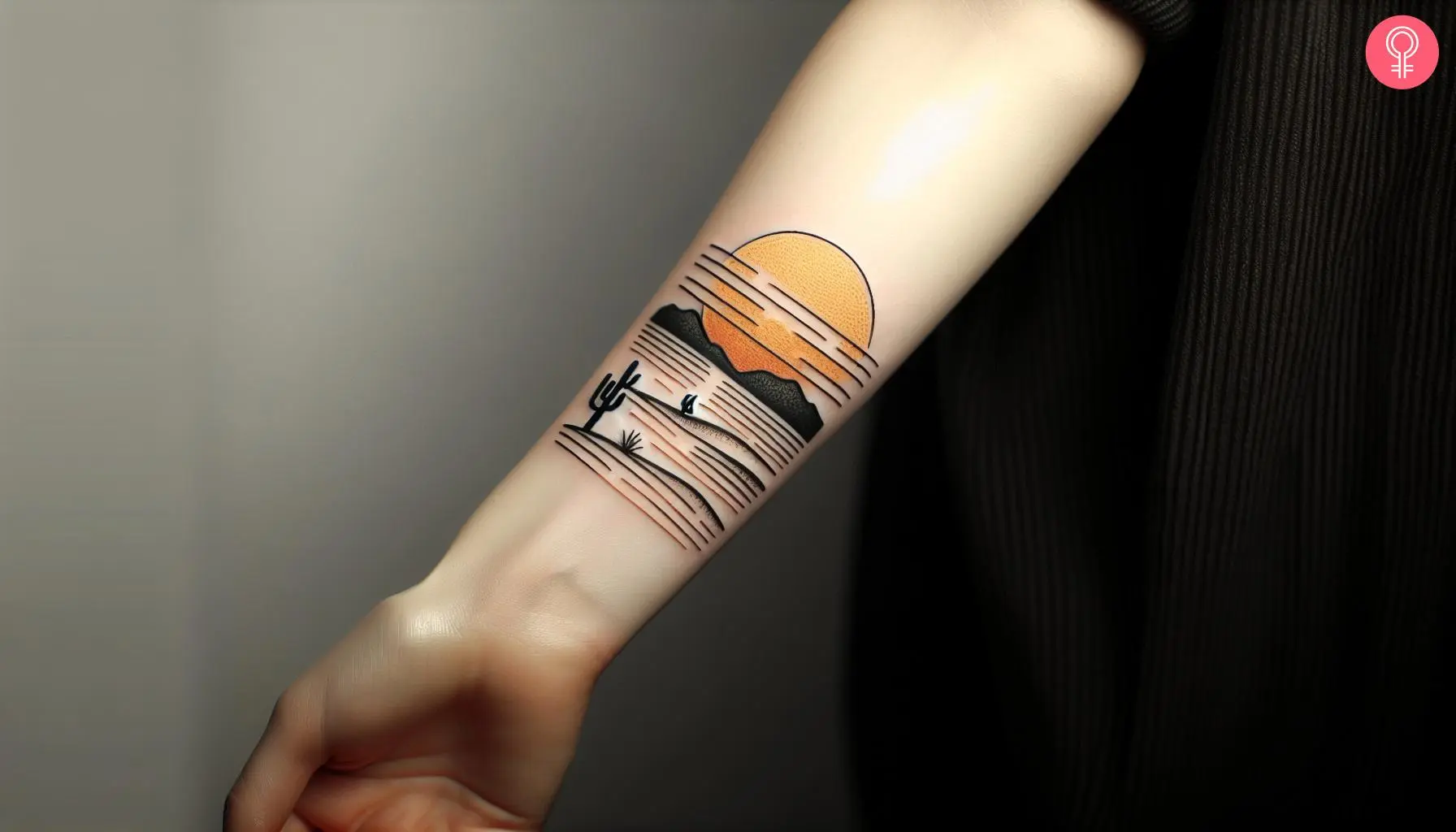 A desert sunset tattoo on the forearm