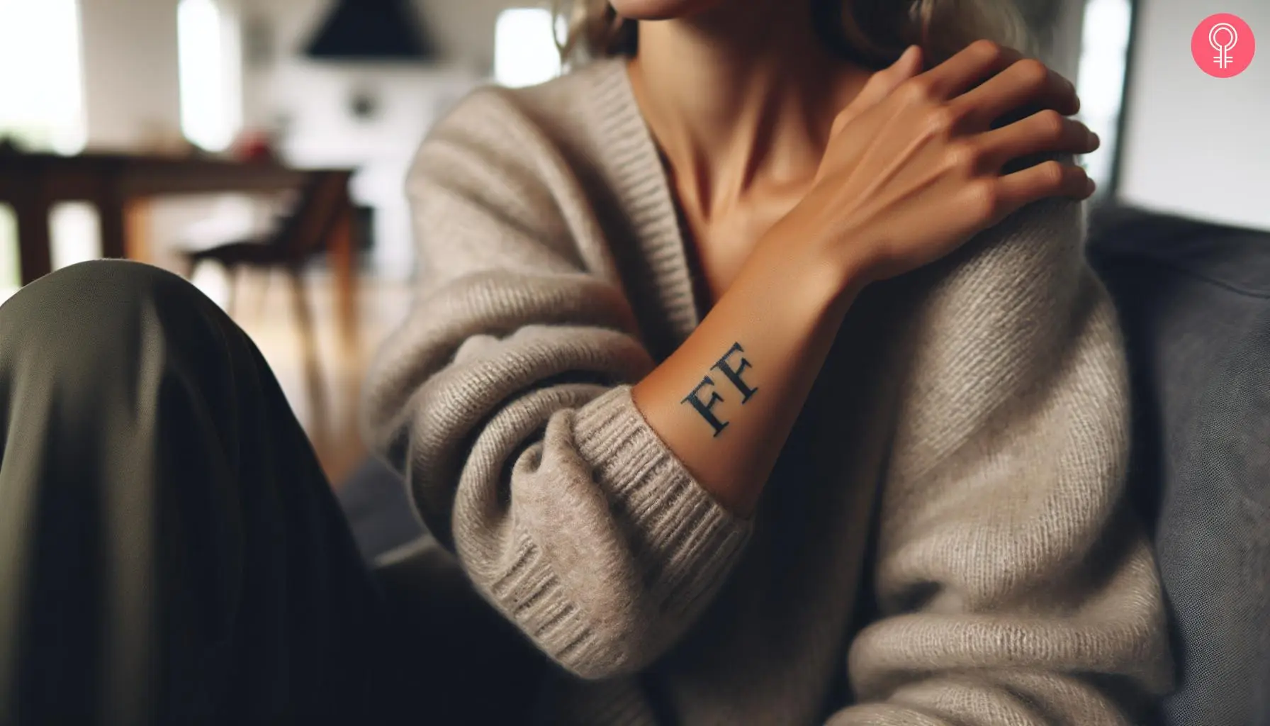 Double F tattoo on the forearm