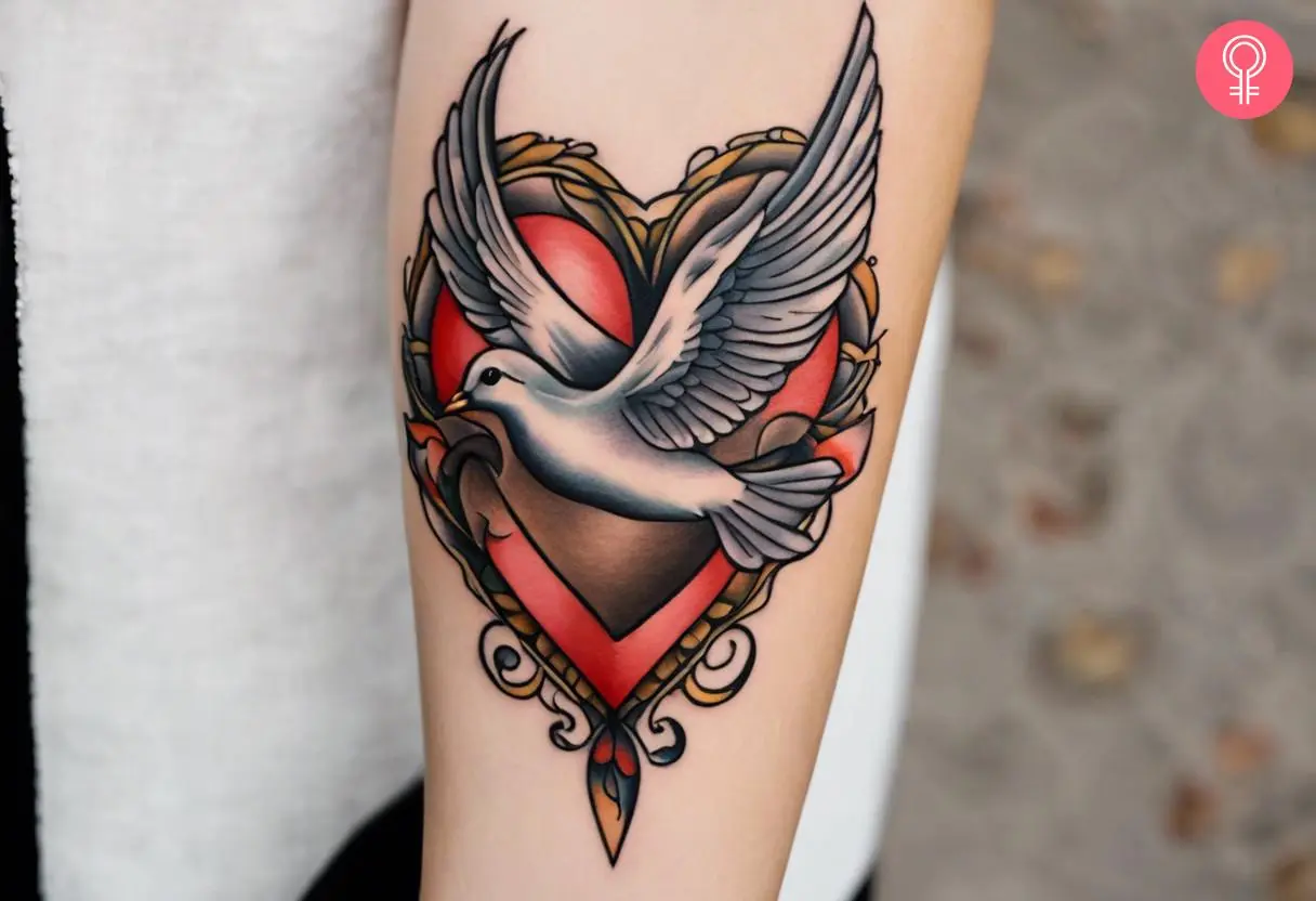 Dove heart feminine tattoo on the forearm