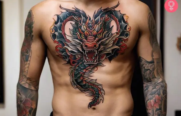 A large dragon torso tattoo in red, black, and gray