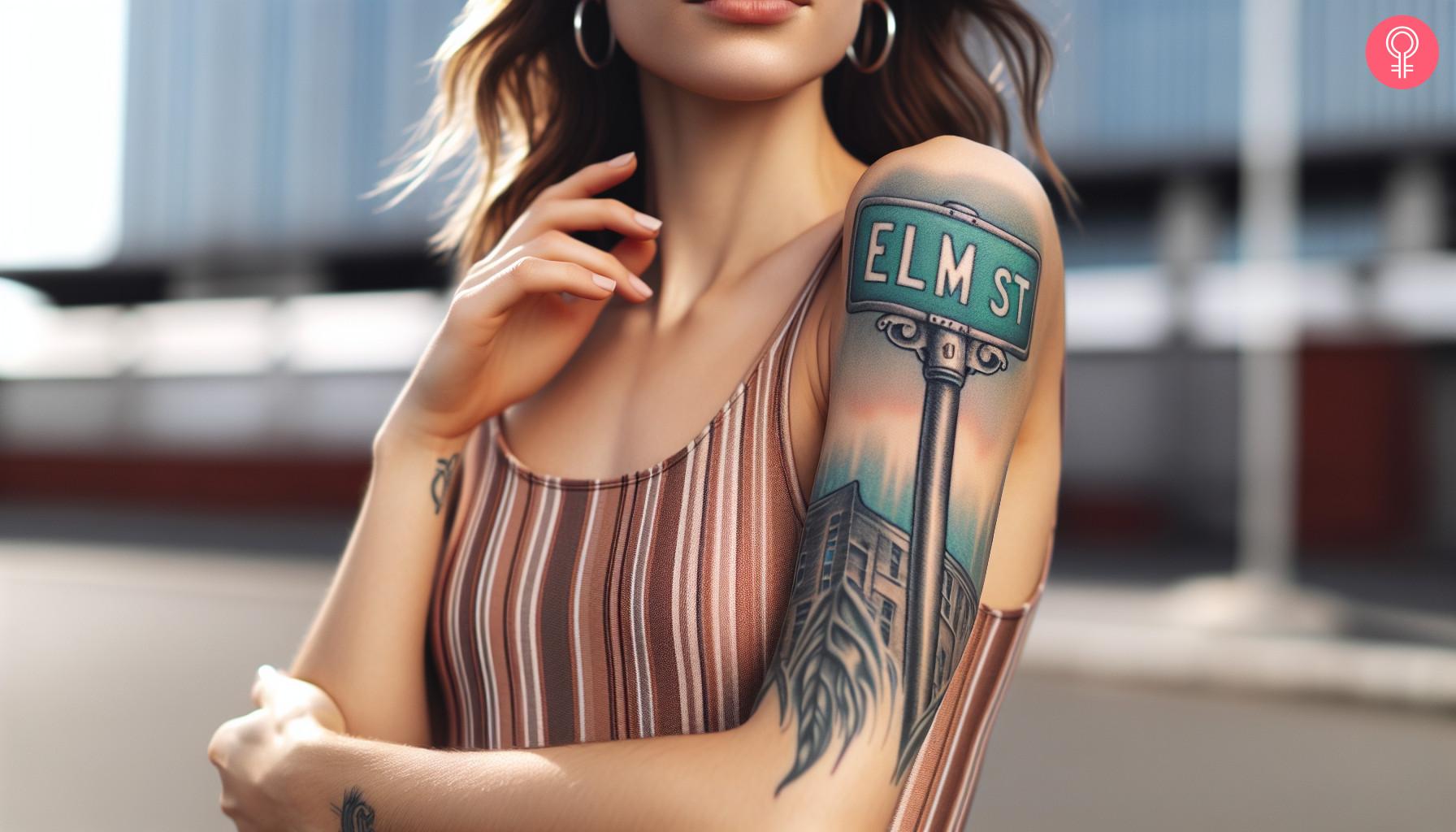 Elm street sign tattoo on a woman's arm