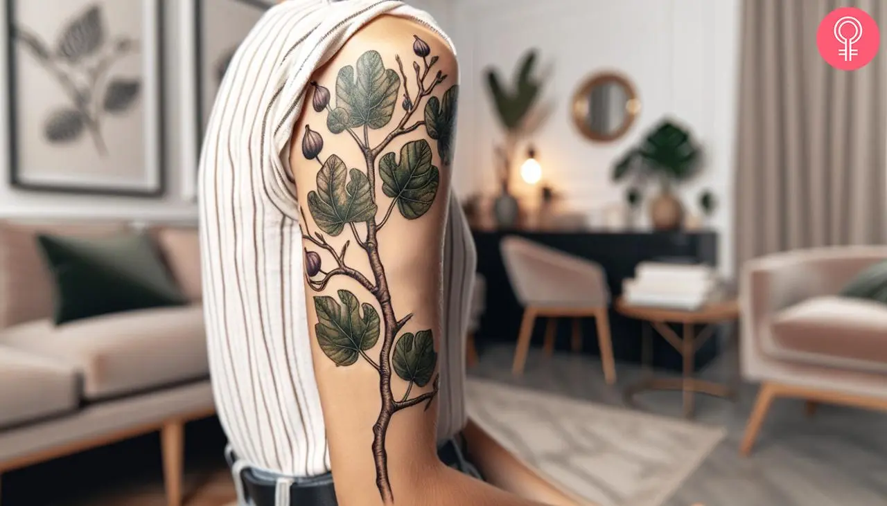 Fig branch tattoo on the upper arm