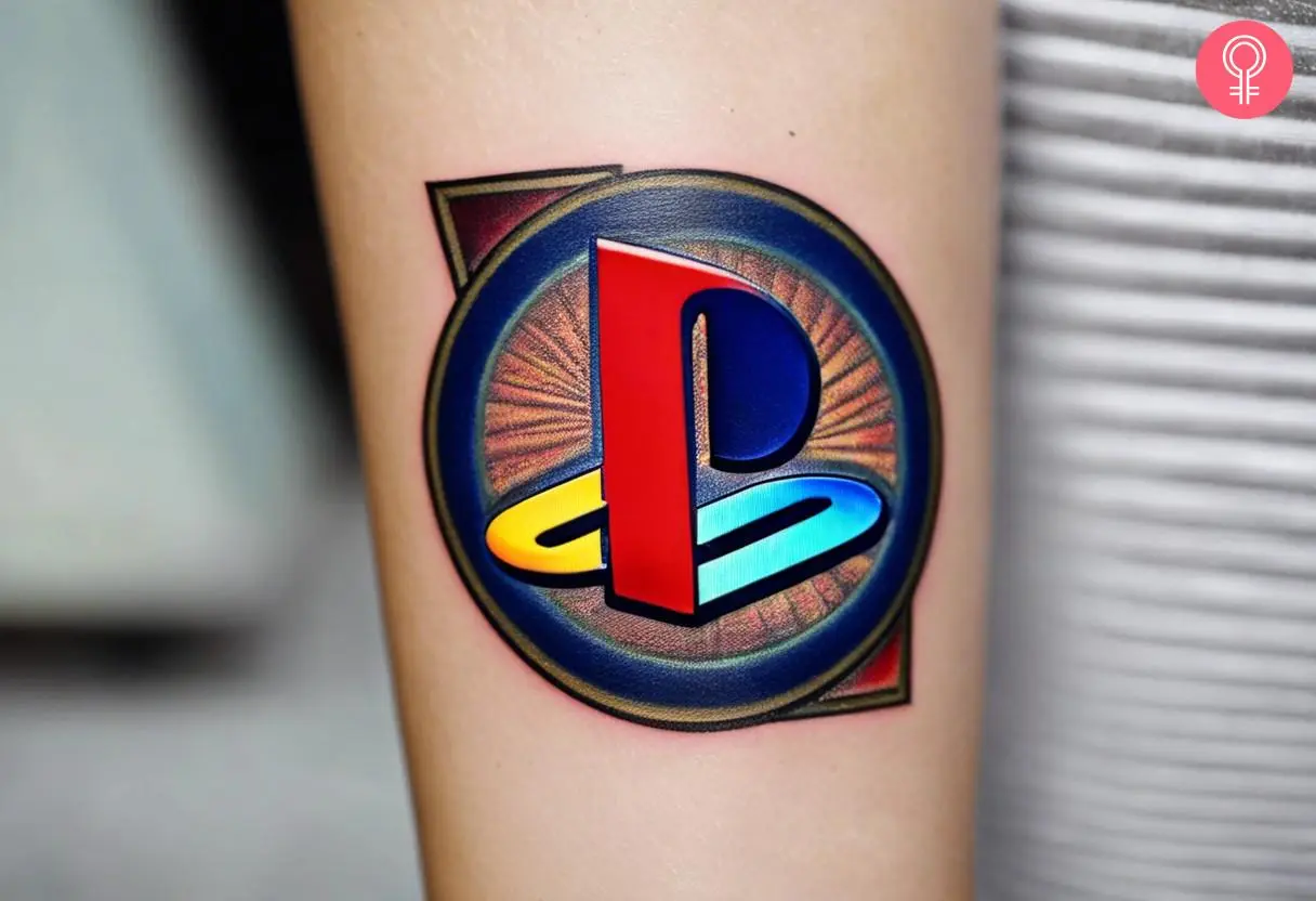 A colorful PlayStation tattoo on a woman’s forearm