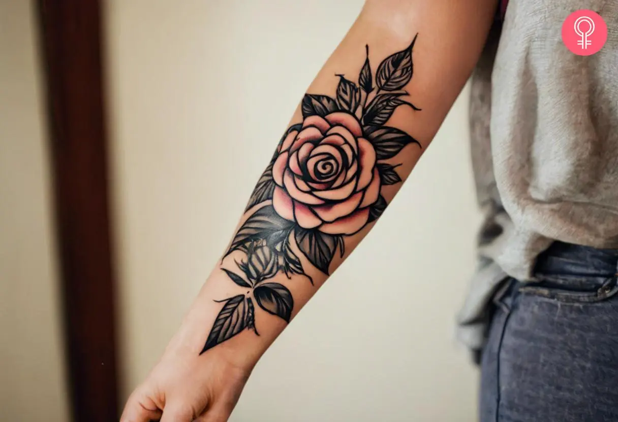 Forearm tribal rose tattoo on a woman