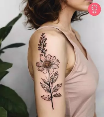 A badger with a flower tattoo on the forearm