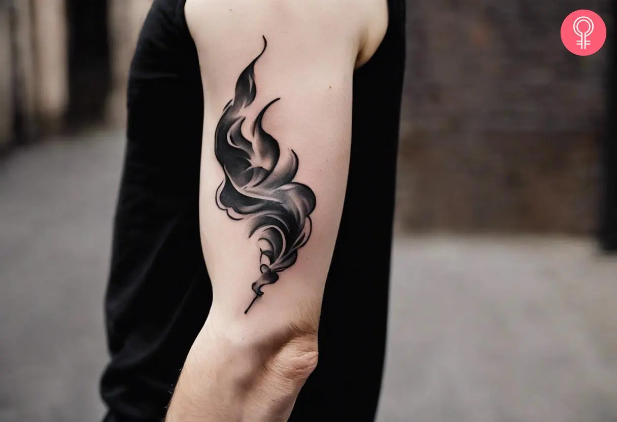 Freehand smoke tattoo on the upper arm