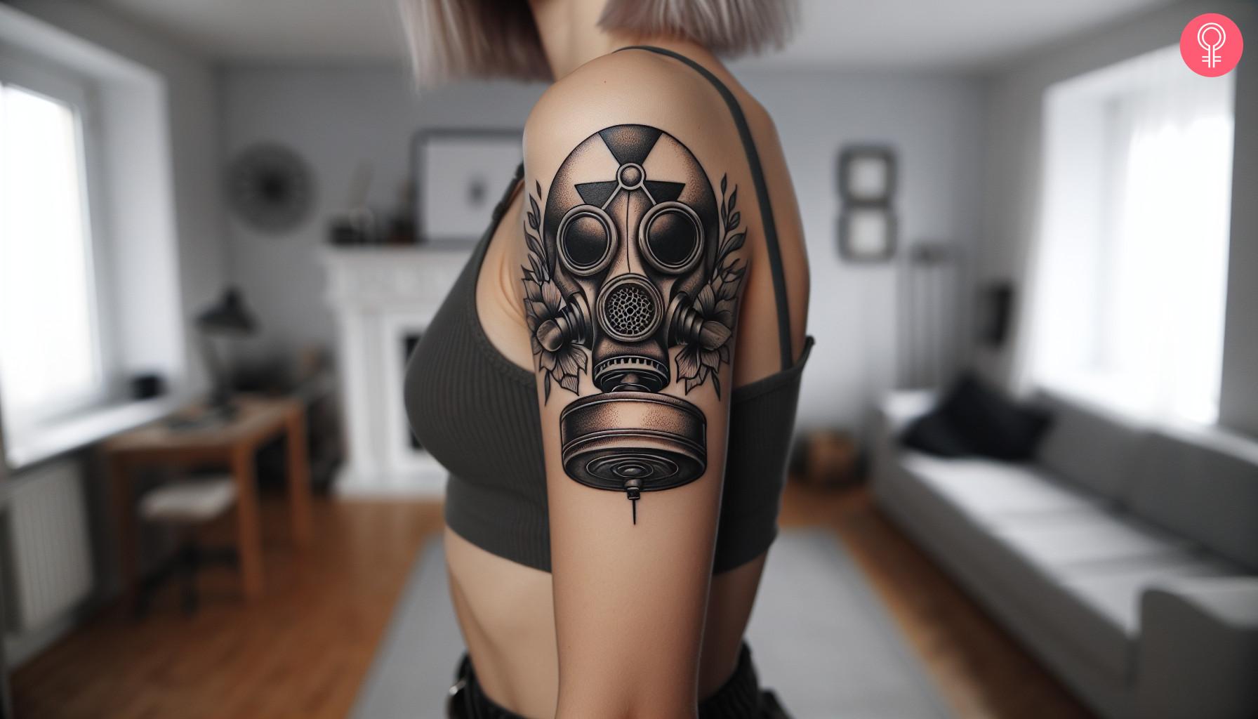 Gangsta gas mask tattoo on upper arm