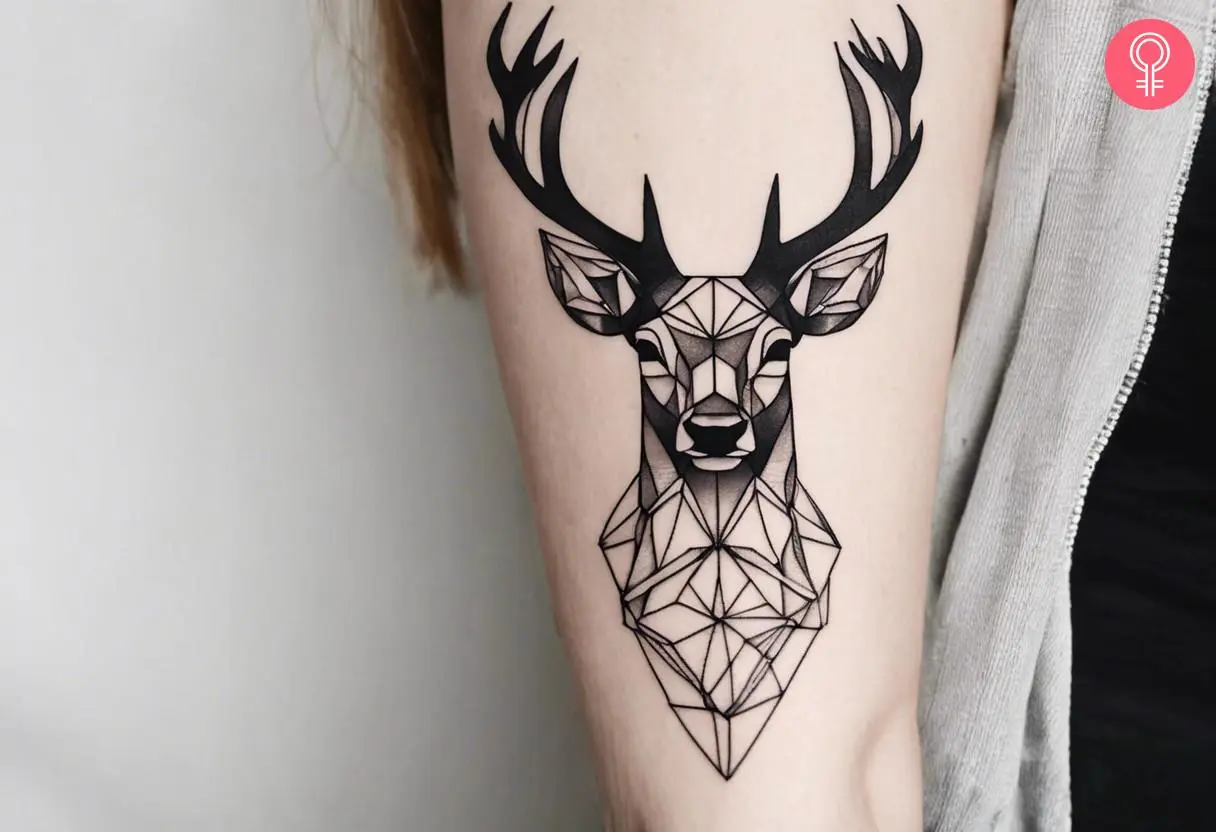 Woman with a geometric stag tattoo on the arm