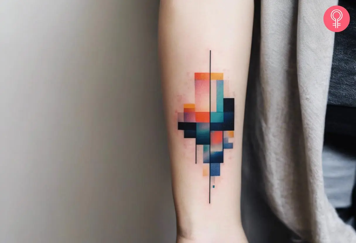 Glitch pixel tattoo on a woman’s upper arm