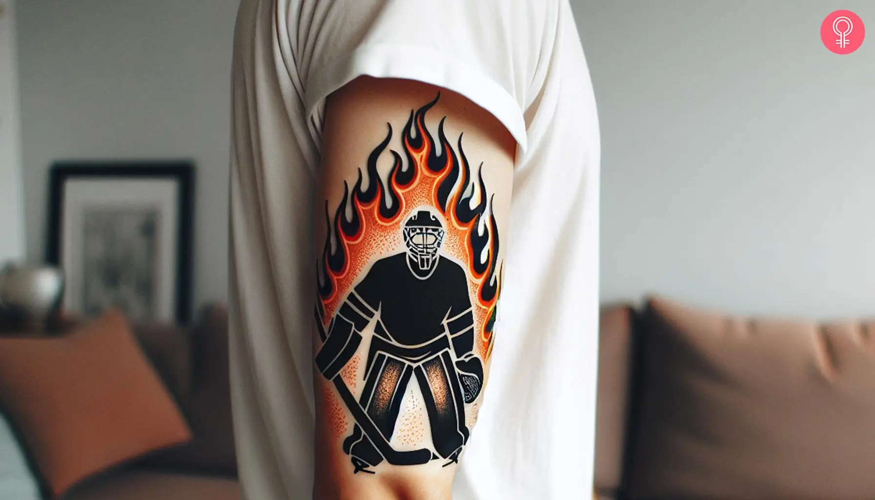 Goalie with fire motifs tattoo on the upper arm