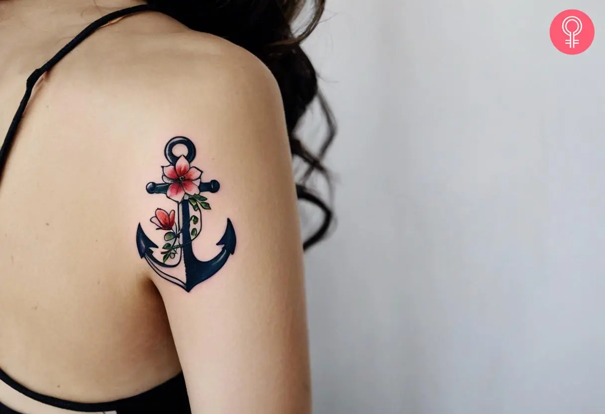 Woman with a healing trauma tattoo of an anchor and flowers on the arm