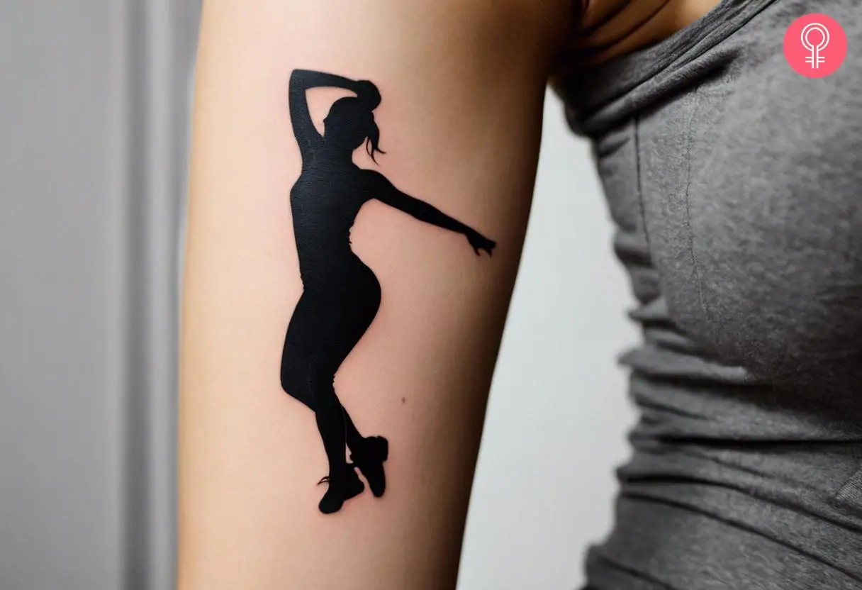 A woman wearing a ‘hip hop dance’ tattoo on the upper arm