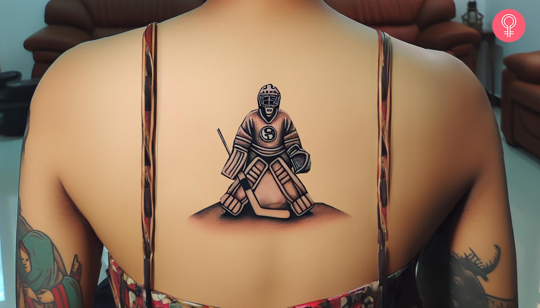 Hockey goalie tattoo on the back