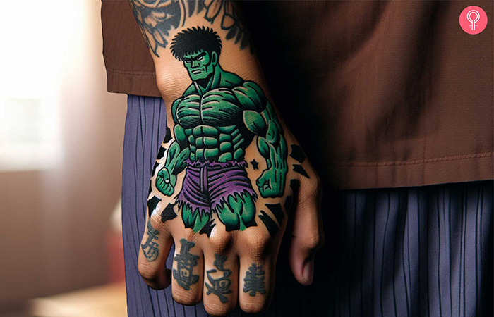 A hulk tattoo on the hand of a man