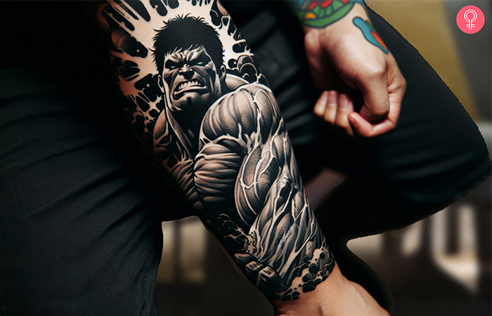 A black and gray hulk forearm tattoo