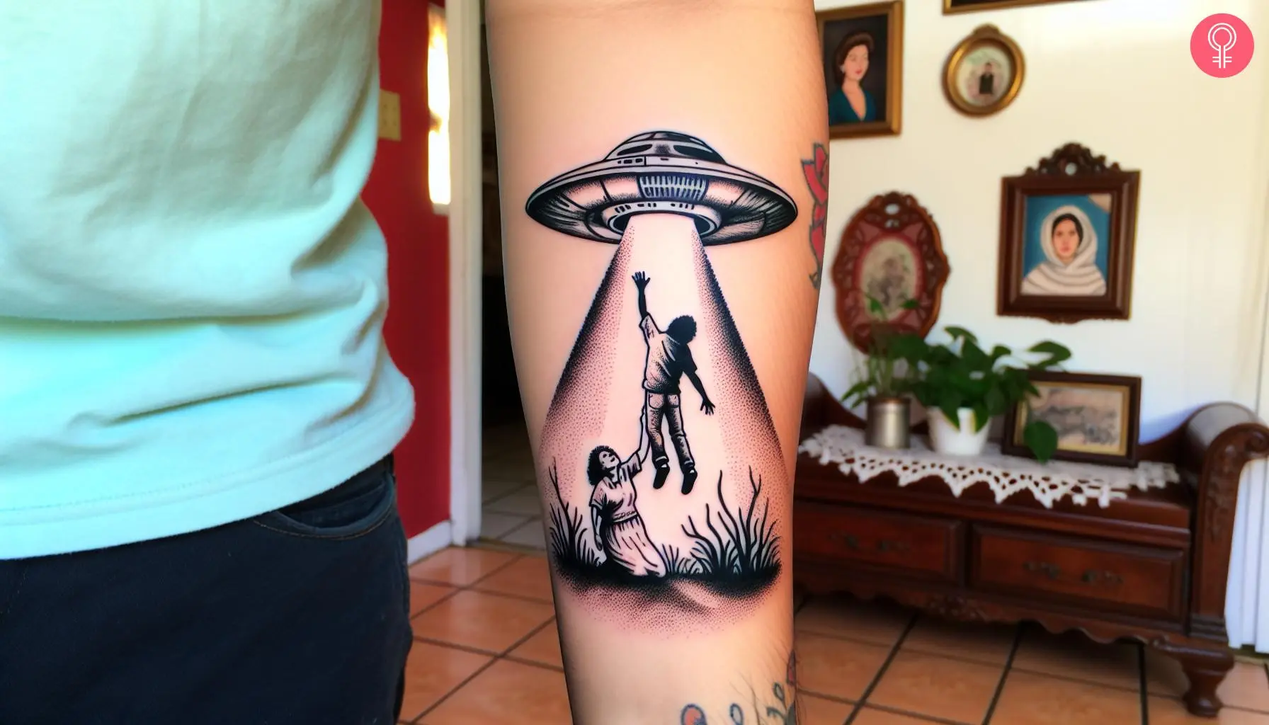 Human sucked into alien spaceship tattoo on the forearm