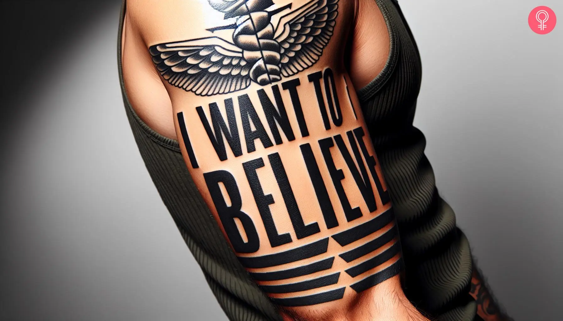 I want to believe tattoo on the upper arm