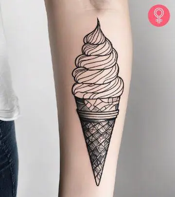 Ice cream inked in line art style on the forearm