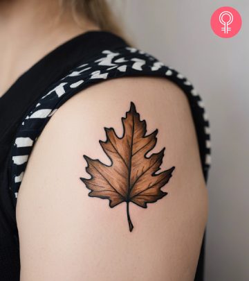 A woman with a floral tattoo with tribal designs