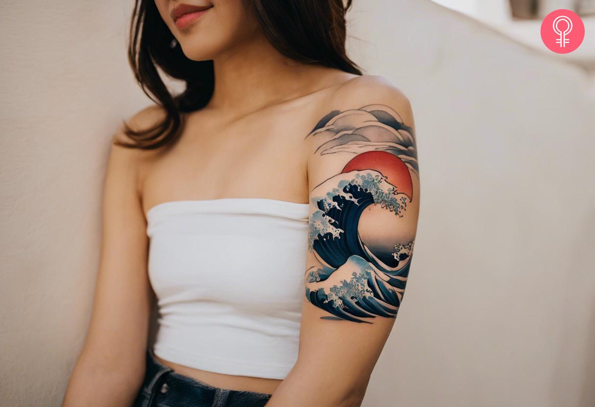 A Japanese-style tattoo featuring high ocean waves and a setting sun