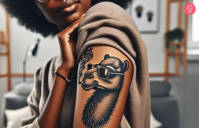 Woman with a Joe Camel tattoo on the upper arm