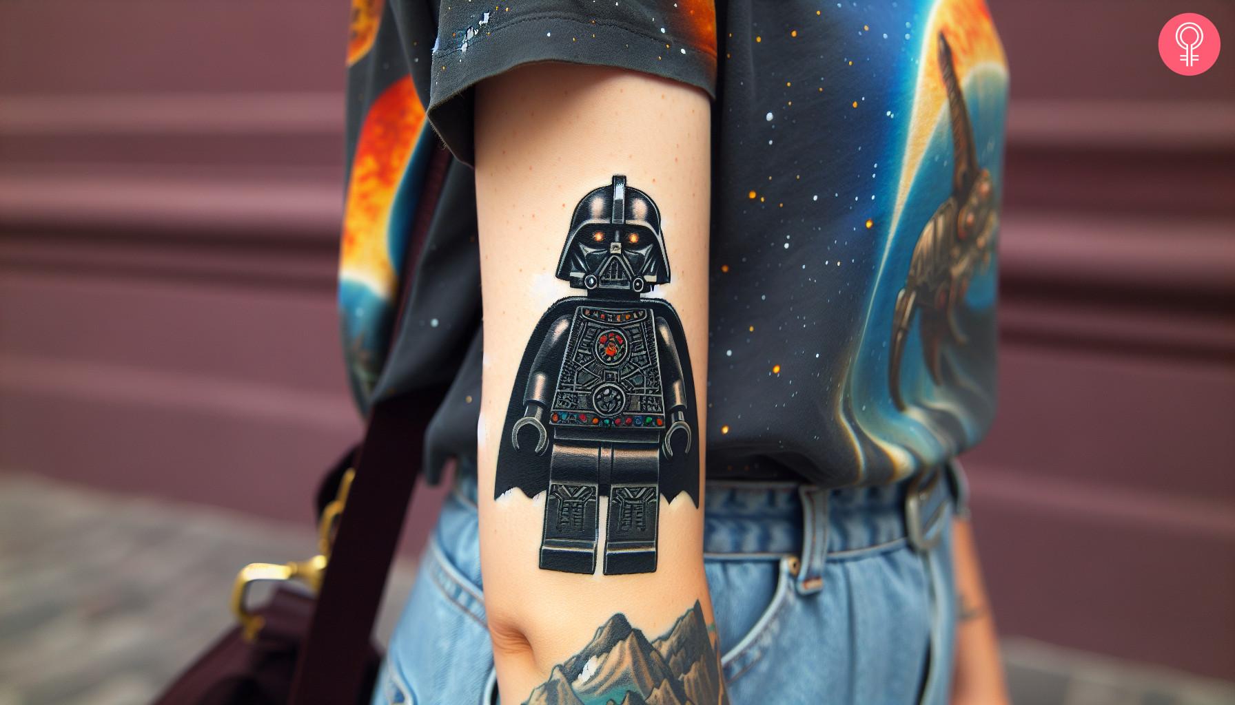 A woman with a colored LEGO Darth Vader tattoo on her upper arm