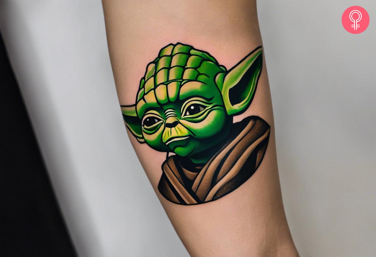 A woman with a colored LEGO Yoda tattoo on her arm