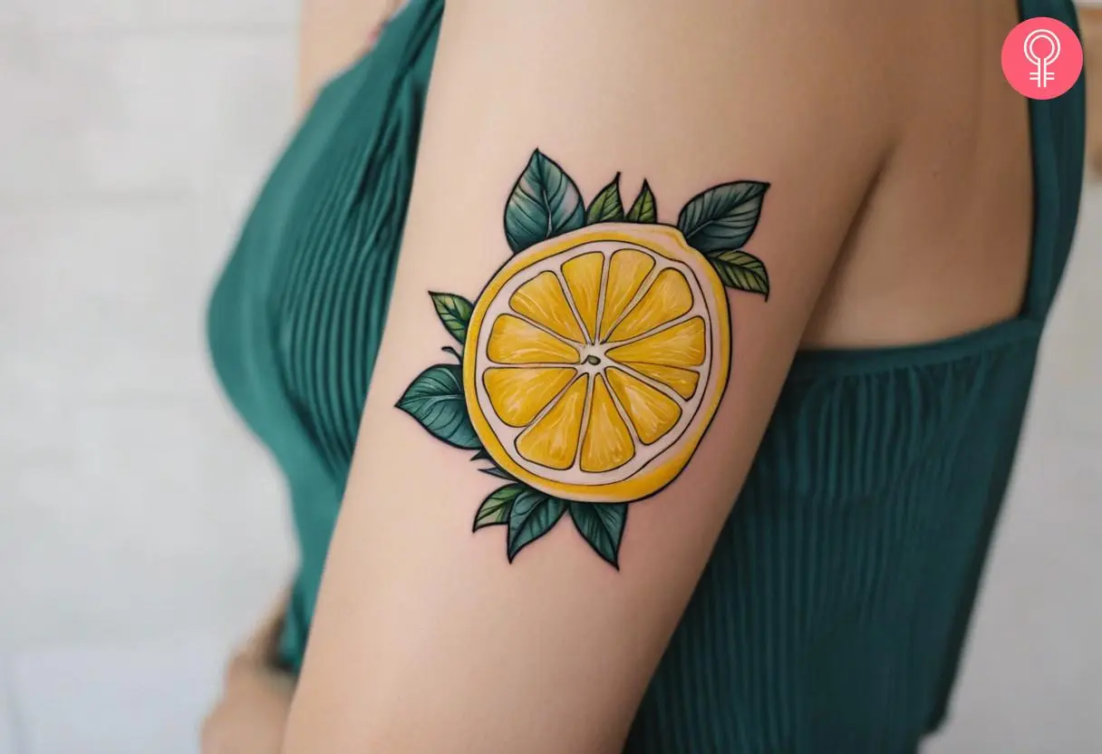 Lemon slice tattoo on the upper arm