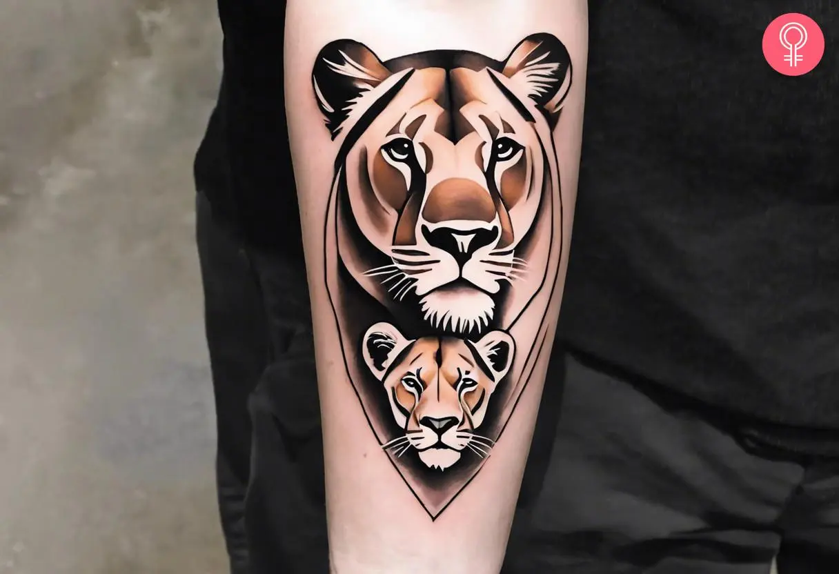 Lion and cub tattoo on the forearm