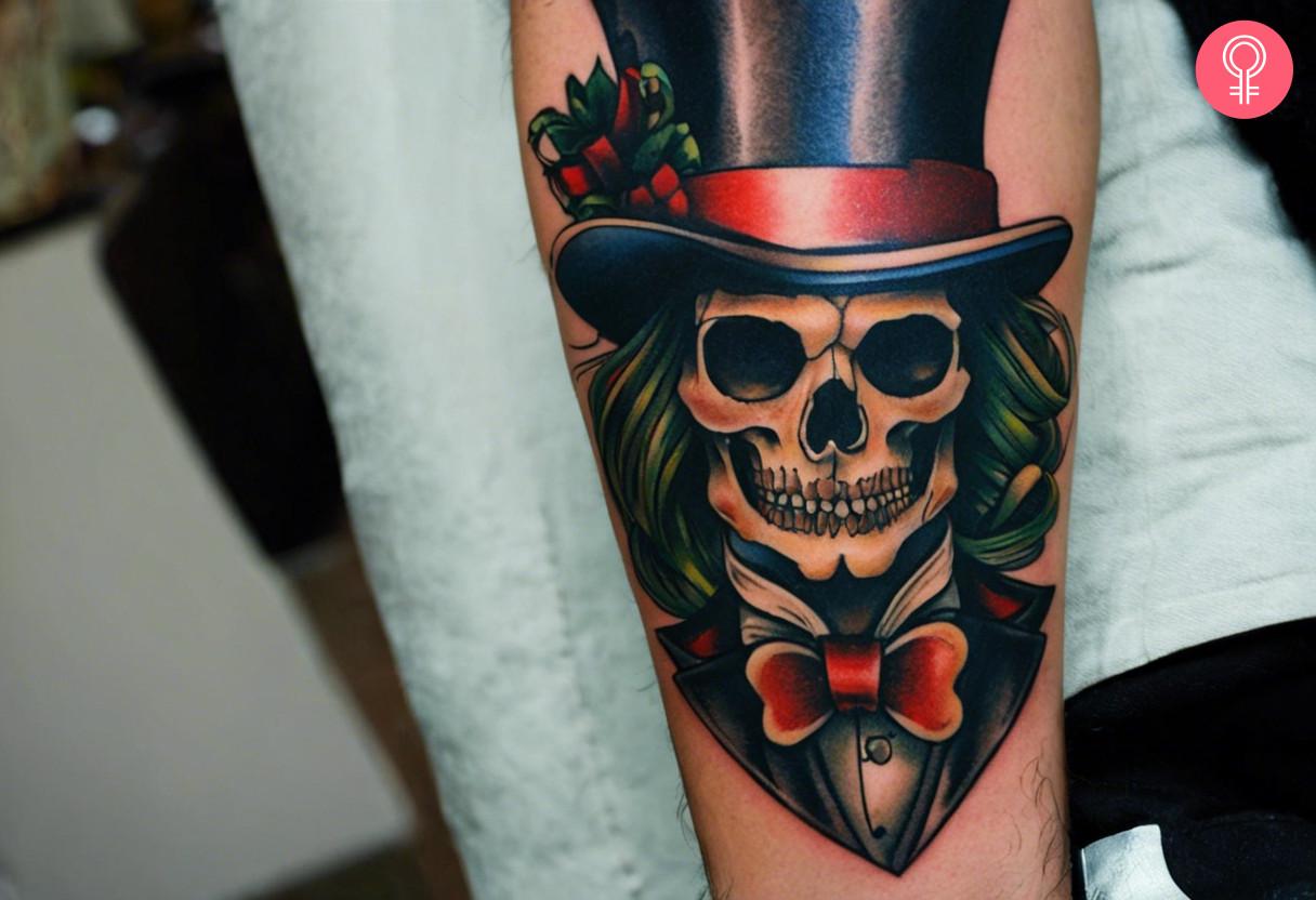 A Mad Hatter skull tattoo on a man’s forearm