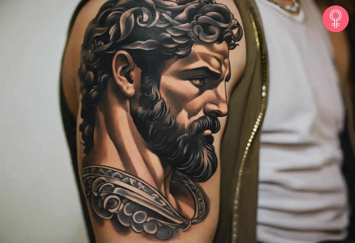 Man with a Greek god Hercules tattoo on the upper arm