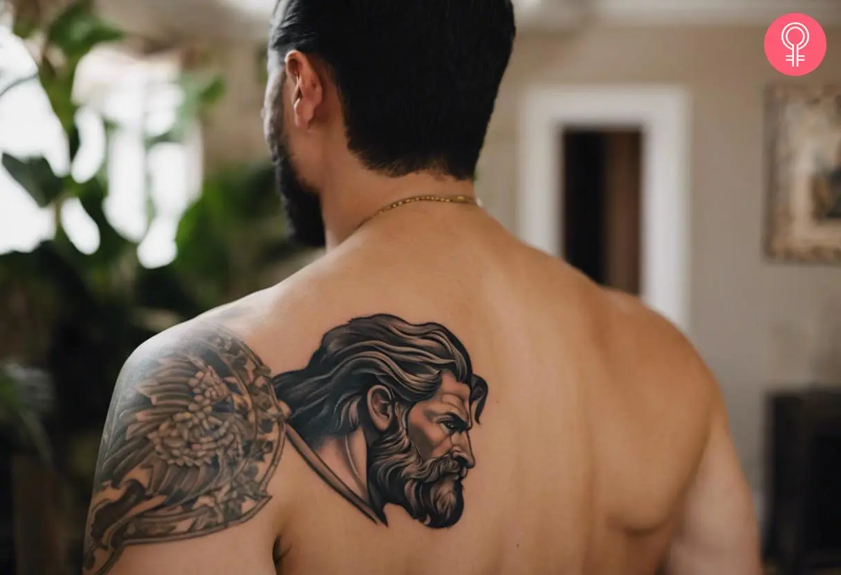 Man with a Hercules shoulder tattoo