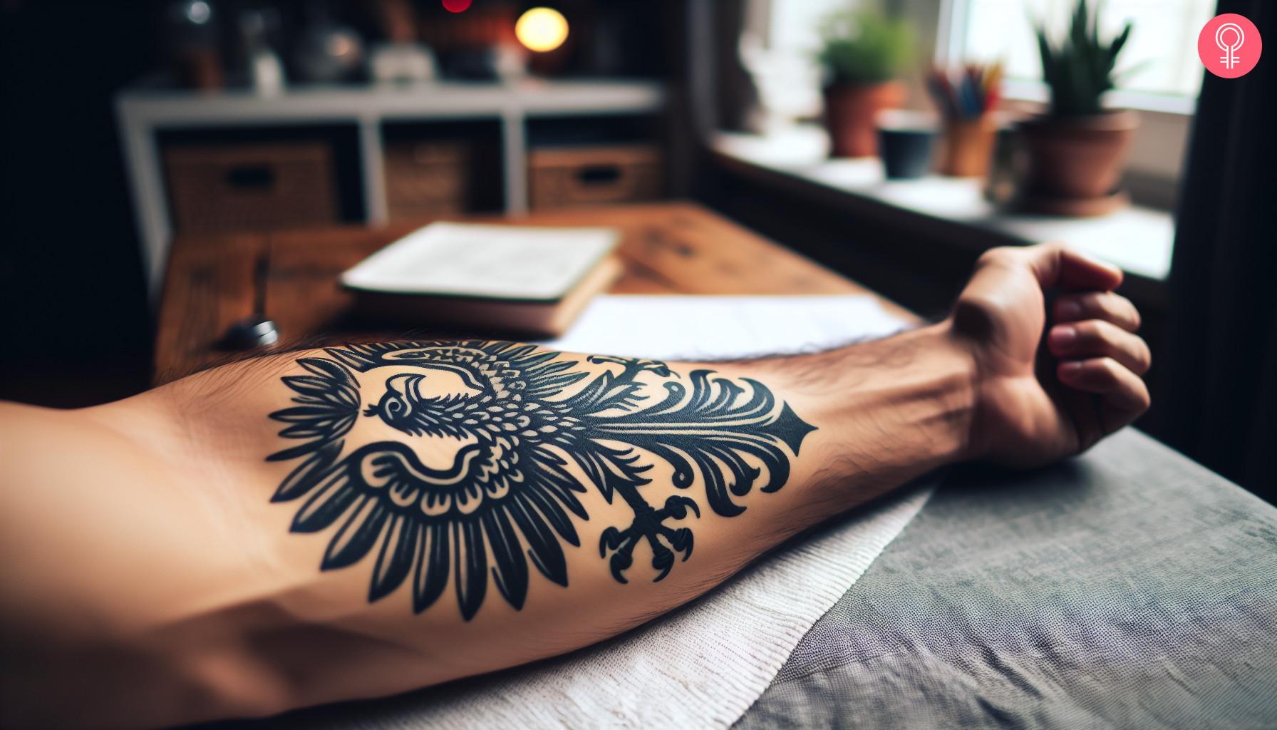 Man with a Polish eagle tattoo on his forearm