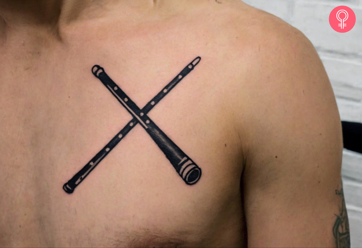 Man with a drumstick tattoo on the front shoulder