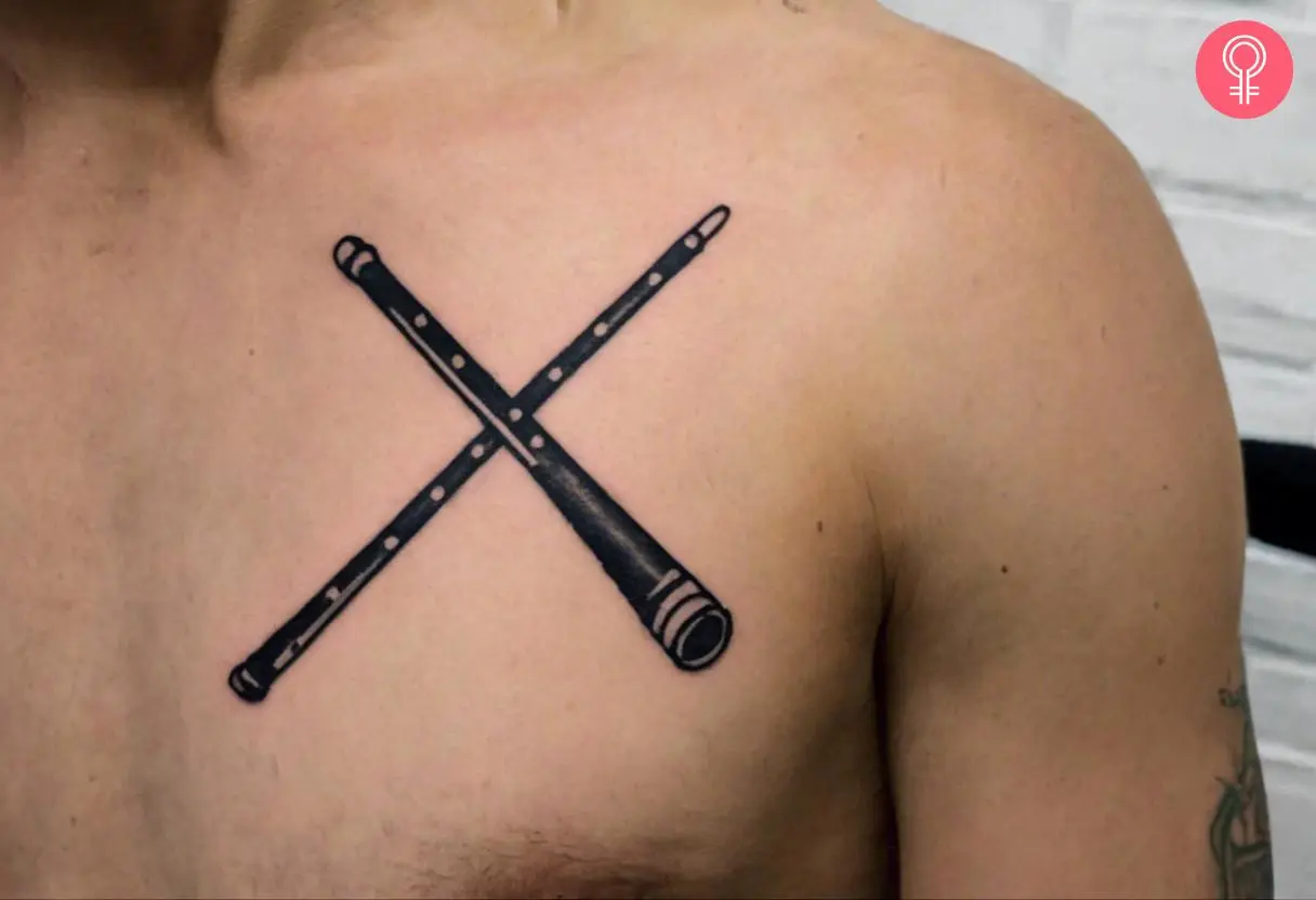 Man with a drumstick tattoo on the front shoulder