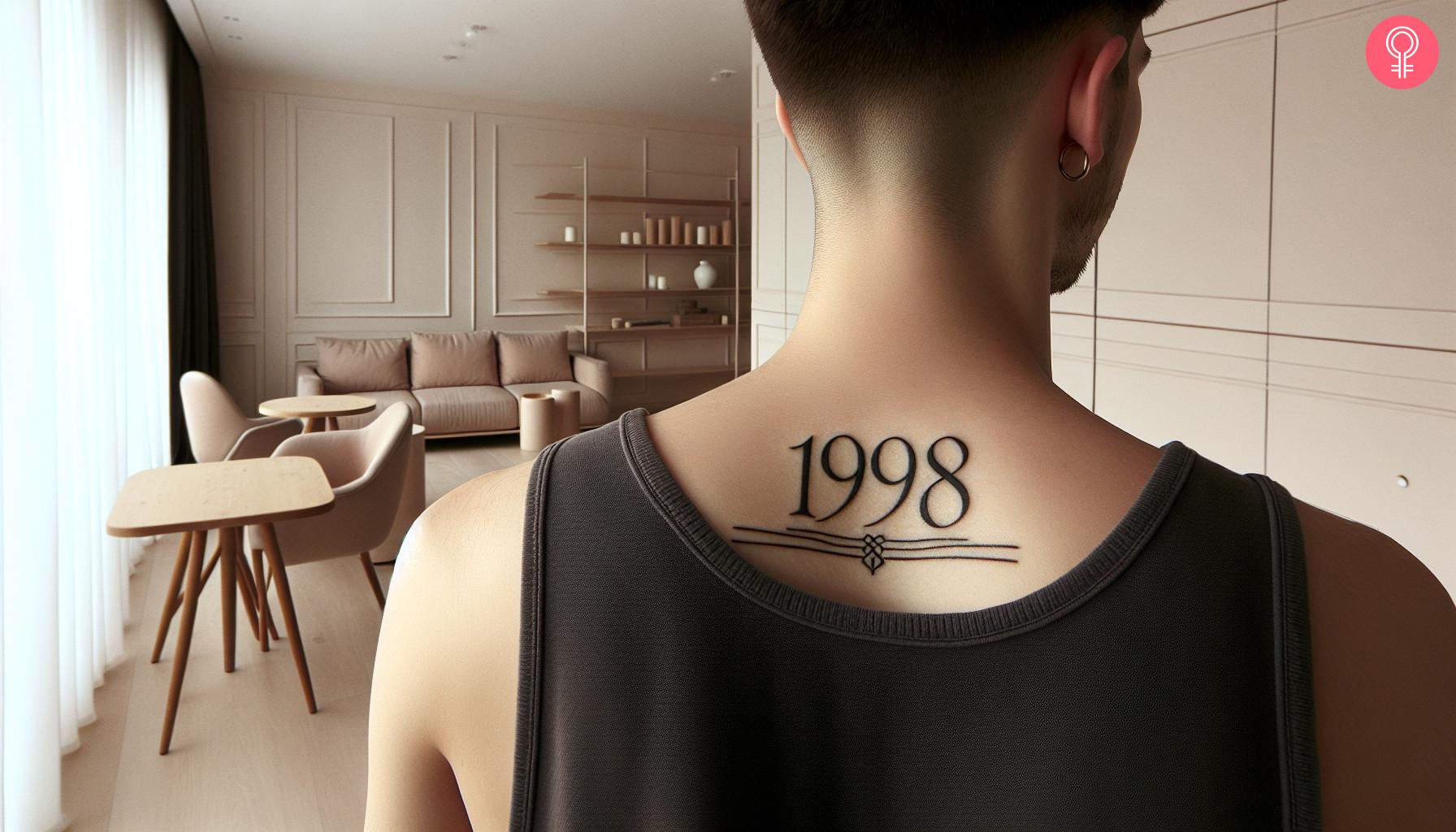 Man with minimalist birth year tattoo on back